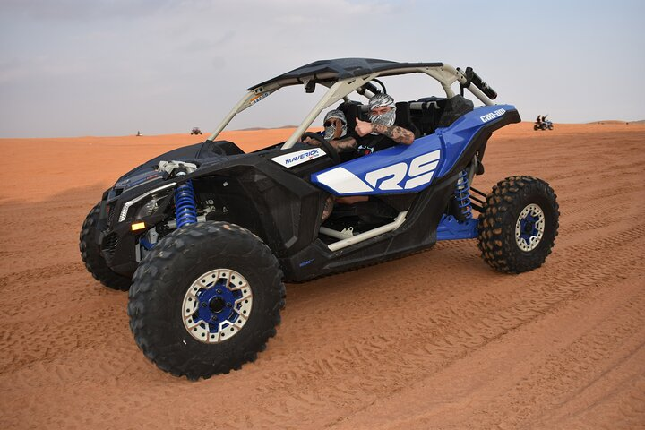 Feel the rush as you navigate Dubai's stunning dunes in the Can-am Maverick X3 Rs Turbo. Capture unforgettable moments with breathtaking desert landscapes and adventurous experiences.